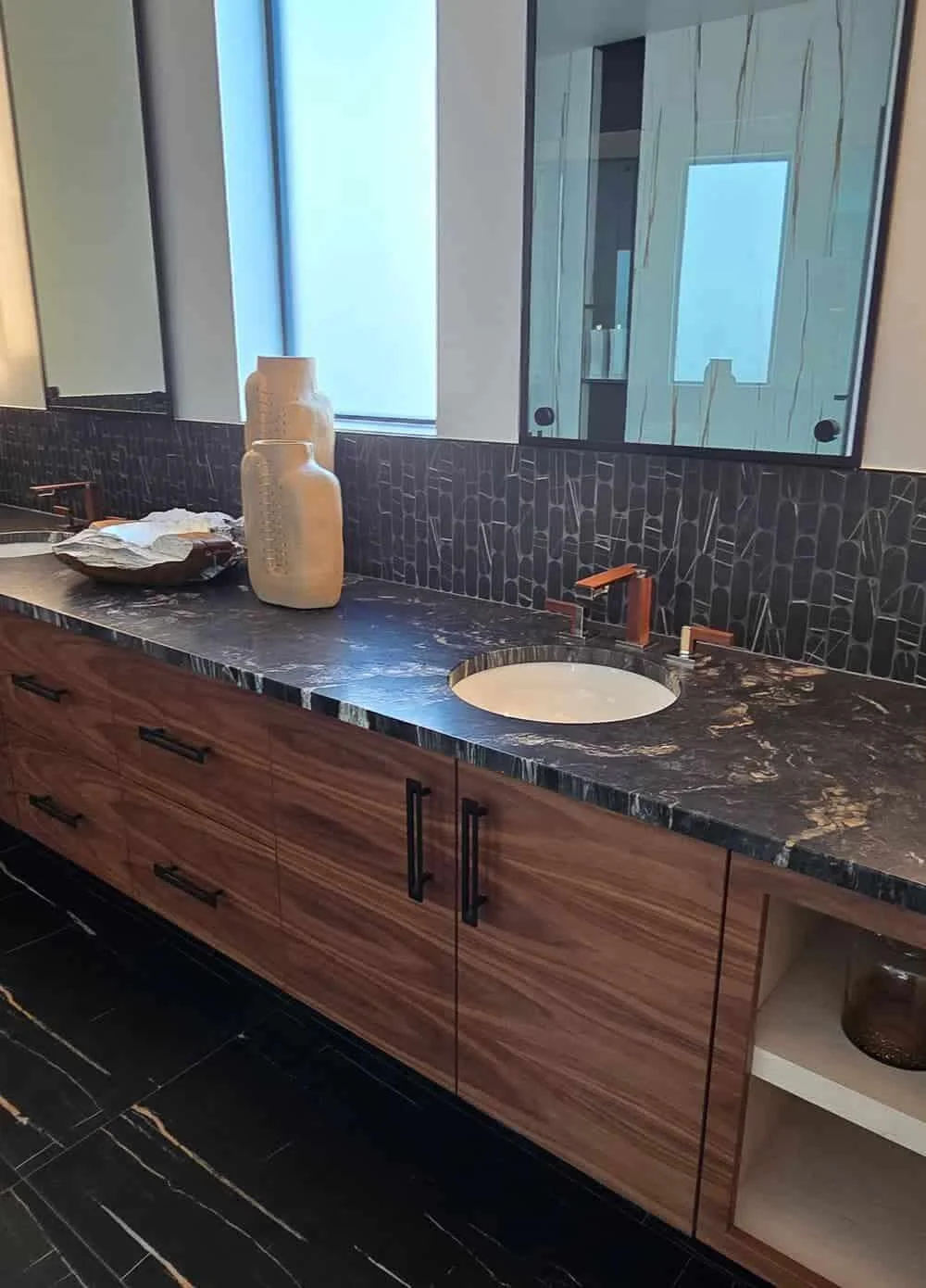 Black-on-black natural stone kitchen design